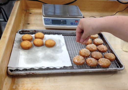 Seeding the glazed doughnut "buns"